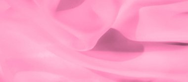 Bulanık pembe kumaş yumuşak kıvrımlar halinde yakalanıyor ve pürüzsüz ve şeffaf bir doku oluşturuyor. Işık, havadar kumaş zarafet ve kadınlık katıyor. Hassas arka planlar için mükemmel..