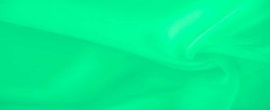 Yumuşak bir gradyanla pürüzsüz ve akışkan kıvrımları vurgulayan bulanık yeşil kumaş görüntüsü, minimalist ve soyut bir kompozisyon oluşturuyor. Hafif gölgeler tasarıma derinlik ve sükunet ekler..