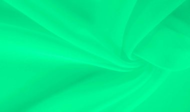 Yumuşak, dalgalı bulanık yeşil kumaş sakinleştirici bir etki yaratıyor. Bükümlerdeki ışık dokusu ve gradyanı kumaşın doğal hareketini vurgular ve mükemmel bir arkaplan sunar.