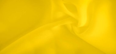 Dinamik bir görüntü oluşturan yumuşak, dalgalı sarı kumaşın bulanık görüntüsü. Parlak sarı ton, yaratıcı tasarım, moda veya soyut sanat kullanımları için ideal hale getirerek, canlı bir dokunuş ekler..