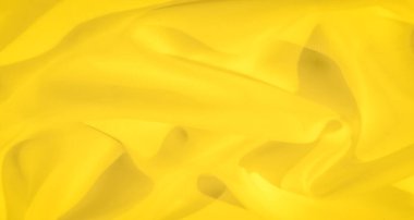 Bulanık sarı kumaş nazik kıvrımlar ve akan kıvrımlar oluşturarak dinamik ama yatıştırıcı bir görsel etki yaratıyor. Parlak, pürüzsüz dokusu onu modern tasarım için mükemmel bir zemin yapar..