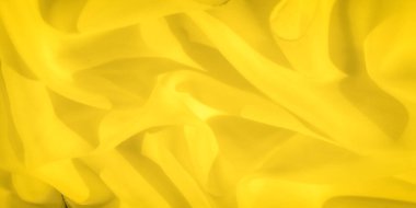 Işık ve gölge etkileşimi ile bulanık sarı kumaş, nazik kıvrımlar ve kıvrımlar yaratır. Parlak, sıcak tonlar bu dokuyu canlı ve yaratıcı projeler için ideal kılıyor..