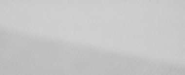 Yüzeyde yumuşak kıvrımları olan bulanık beyaz kumaş rahatlatıcı ve soyut bir zemin oluşturuyor. Yumuşak dokular ve gölgeler minimalist ve çok yönlü estetiğe eklenir