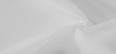 Yumuşak kıvrımları ve yumuşak kıvrımları olan bulanık beyaz kumaş rahatlatıcı ve zarif bir soyut doku yaratıyor. Düz yüzey, minimalist bir cazibe için ışık ve gölgeler sergiliyor.