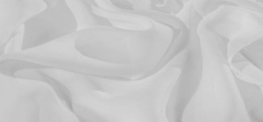 Yumuşak, akışkan kıvrımlı beyaz kumaşın bulanık görüntüsü ışık ve hava malzemesinin özünü yakalıyor. Pürüzsüz yüzey minimalist, zarif, temiz ve sakin tasarımlar için mükemmel..