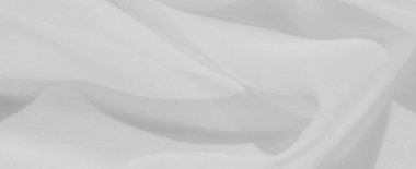 Yumuşak kıvrımları ve pürüzsüz dokusu olan bulanık beyaz kumaş. Pürüzsüz ve akışkan madde, soyut ya da temiz kompozisyonlar için mükemmel minimalist ve dingin bir tasarım yaratır..