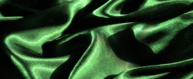 Bulanık yeşil saten kumaş kaplama yumuşak piller ve parlak bir kaplama. Parlak doku derinlik ekler, ışık yansıması ise zengin ve pürüzsüz yüzeyi güçlendirir..