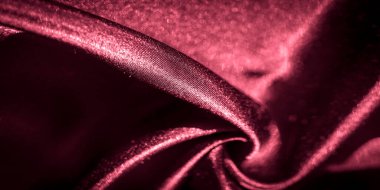 Yumuşak dalgalar ve kıvrımlı parlak kırmızı saten kumaş bulanıklığı. Lüks ve şehvetli bir doku yaratmak için ışığı yansıtıyor. Moda, tasarım ve soyut yaratıcılık için mükemmel..