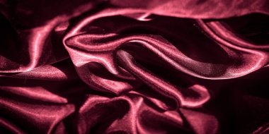 Pürüzsüz dokuma ile bulanık kırmızı saten: Pürüzsüz, pırıl pırıl bir yüzeye sahip, lüks bir kırmızı saten kumaş akışı, zarif ve yumuşak soyut bir tasarım yaratıyor üst düzey metin için mükemmel