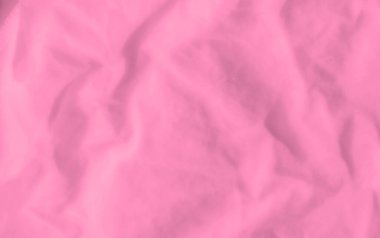 Yumuşak kıvrımları ve ince gölgeleri olan canlı pembe kumaş bulanıklığı. Yumuşak doku ve akışkan hareket barışçıl ve soyut bir tasarım yaratır..