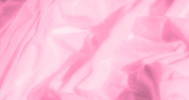 Yumuşak kıvrımları ve pürüzsüz dokuları olan pembe kumaş bulanıklığı. Hassas gölgeler ve pastel tonlar bu minimalist soyut kompozisyonda bir zarafet ve sükunet hissi uyandırıyor..