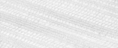 Karmaşık ve hassas desenleri olan beyaz dantel kumaş bulanıklığı. Yüzeyde yavaşça akıyor. İnce örgüler ve yansıtıcı dokular zarif, yumuşak ve lüks bir cazibe yaratıyor..