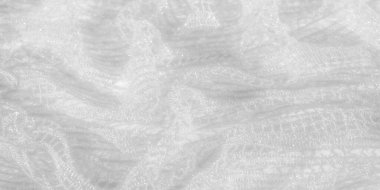 Karmaşık beyaz dantel kumaşın bulanık görüntüsü ince desenli narin bir desen sergiliyor dantel iplikler parıldıyor, moda ya da düğün tasarımları için ideal yumuşak, zarif bir görünüm yaratıyor.