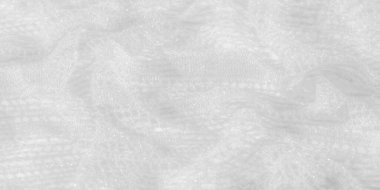 Beyaz, bulanık dantel kumaş. Detaylı ve parıltılı deseniyle usulca dökülüyor. Zarif, hafif kumaş gelinlik, gelinlik ve moda aksesuarları için idealdir..