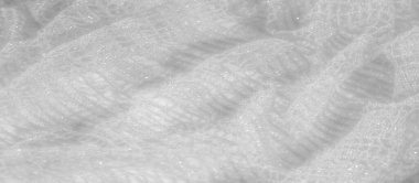 İnce beyaz dantelli bulanık parlak detaylar ve karmaşık desenler, şeffaflık ve zaraflığını sergiliyor. Gelin modası, dekor ve kadınsı tasarım kavramları için ideal..