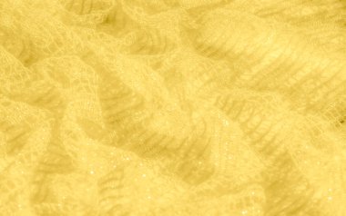 Parlak yansımaları ve ince kıvrımları olan canlı sarı bir kumaşın bulanıklığı. Parlak dokusu dinamik ve parlak bir yüzey sağlar, tekstil ve tasarım için mükemmeldir..