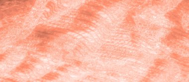 İnce şeftali dantelli kumaş bulanıklığı. Karmaşık meshwork 'ünü ve ışık parıltısını gösteriyor. Katlar, lüks tekstil ve moda projeleri için mükemmel bir doku oluşturuyor..