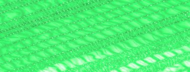 Işıldayan ışıktaki yeşil dantel kumaşın yumuşak ve parlak kıvrımlarını bulanıklaştırarak karmaşık ağ dokusunu ve ayrıntılı desenini ortaya çıkarıyor. Işık oyunu yüzeyde büyüleyici bir etki yaratır.