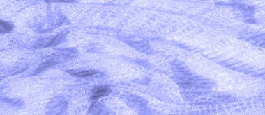 Görüntü - Mavi dantelli kumaşın detaylı bir görüntüsü, karmaşık ve narin dokumasını gösteriyor. Yumuşak ışık dokuyu vurgular, rahatlatıcı ve sakin bir ortam yaratır..