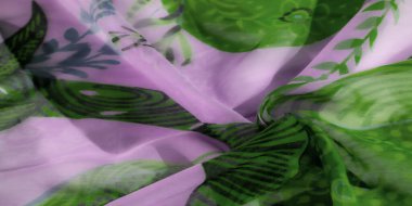 Soyut botanik desenlerle süslenmiş lavanta yeşili bir kumaş. Hafif kumaş yumuşak bir şekilde dalgalanır, zarif ve havadar bir estetik yaratır ve bu da şık kıyafetleri tamamlar..