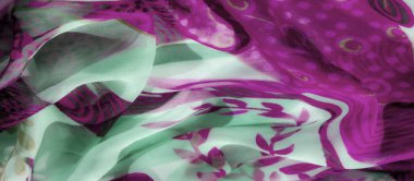 Pembe bir bulanıklık ve zarif girdap şekilleriyle süslenmiş nane yeşili kumaş. Hafif, havadar malzeme, modern, şık ve zarif bir estetik sunarak hareket ve dokuyu yakalar..