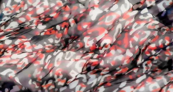 Saf bir kumaşın bulanık, soyut, düzensiz desenler kırmızı, mor ve siyah tonlarda. Şeffaf madde dinamik ve canlı renklerini vurgulayan katmanlı, akışkan bir doku yaratır.