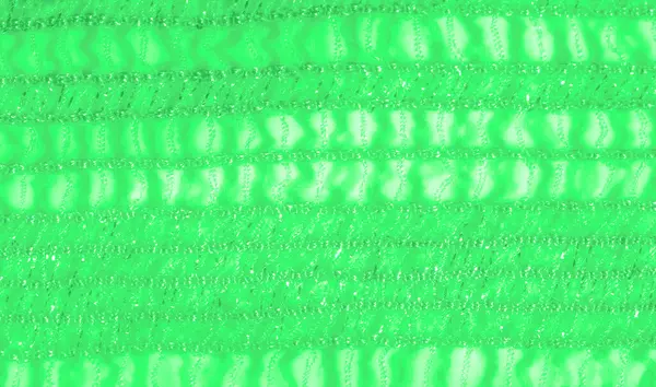 Narin yeşil dantel kumaşı bulanıklaştırın. Karmaşık tasarımlar ve parıldayan bir dokuya sahip ışıkta parıldayın. Kumaşın yumuşak parıltısı onu arka plan olarak ya da yaratıcı tekstil olarak kullanmak için mükemmel kılar.