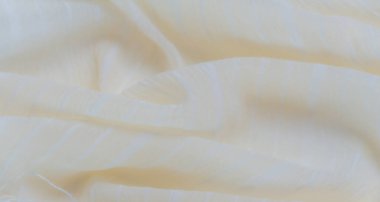 Bu açık sarı kumaş yumuşak, ince tasarım elementleri için mükemmel, rahatlatıcı bir görsel etki yaratan nazik kıvrımlar ve ince desenli çizgiler içerir..