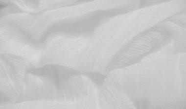 Pürüzsüz, beyaz desenli, karmaşık dalgalar ve kıvrımlar gösteren bir bulanıklık. Yumuşak dalgalanmalar, tasarım projelerinde kullanım için ideal, zarif ama zarif bir yüzey oluşturur..