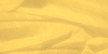 Hassas kırışıklıkları ve kıvrımları olan bulanık sarı kumaş akış yapısını ön plana çıkarıyor. Yumuşak doku ve ince ışıklandırma, sakin ve zarif bir tekstil tasarımı yaratır..