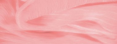 Yumuşak, akıcı kıvrımları ve pürüzsüz bir dokusu olan şeftali rengi bir kumaşın bulanıklığı. Hassas kırışıklıklar ve ince parıltı, kumaşın görsel çekiciliğini arttıran sakin ve zarif bir estetik yaratır..