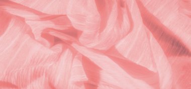 Hafif ışık yansıması olan yumuşak pembe kumaş bulanıklığı pırıl pırıl bir etki yaratır. Hassas dokusu doğal olarak katlanır, kumaş için sakin ve zarif bir his yaratır..