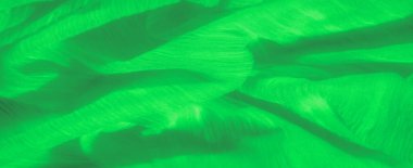 Yumuşak yeşil kumaş dalgaları hassas, akışkan ipliklerle ruhani ve dinamik bir görsel deneyim sağlıyor. Soyut, doğadan esinlenilmiş ya da ekolojik bilinçli projeler için ideal.