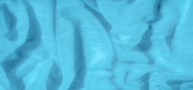 Yumuşak kıvrımlı canlı mavi kumaş bulanıklığı dinamik dalgalı bir doku yaratıyor. Pürüzsüz malzeme sakinleştirici bir akış sergiliyor, zarafet ve sükunet hissi ekliyor.
