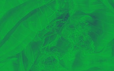 Katmanlı kıvrımları ve ince kırışıklıkları olan yeşil kumaş bulanıklığı ışıkla oynayan dalgalı, dalgalı bir doku oluşturuyor. Pürüzsüz yüzey ve zengin ton, maddenin yapısının güzelliğini vurgular.