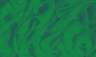 Yumuşak kıvrımları ve narin dokusuyla akan yeşil kumaş bulanıklığı uyumlu ve pürüzsüz bir zemin oluşturuyor. Işığın etkileşimi pürüzsüz yüzeyi tekstil için ideal hale getirir.