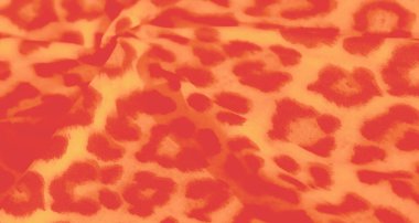 Kırmızı ve sarı kumaşlı, soyut hayvan esintili baskılar. Kumaşın sıvı dokusu ve kalın deseni onu yaratıcı projeler, moda ve ev dekorasyonu için ideal kılıyor..