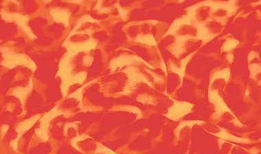 Görüntü. Parlak turuncu ve sarı renkli, leopar desenli çarpıcı bir kumaş. Kumaşın akış katları hareket ve doku ekler, bu da onu cesur ve yaratıcı projeler için ideal kılar..