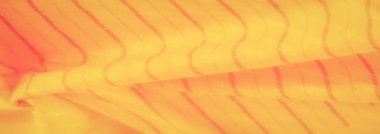 Dinamik kıvrımları ve yumuşak dokuları olan parlak turuncu ve sarı bir kumaş. Kumaşın akışı güzel, soyut bir model yaratır, canlı, yaratıcı arka planlar veya tasarımlar için mükemmeldir..