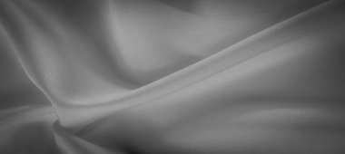 Yumuşak dokular ve yumuşak gölgeler yaratan doğal kıvrımlı zarif gri tonlu kumaş. Bu basit ama rafine edilmiş tekstil, entellektüelliğe ihtiyaç duyan arka plan ve görsel projeler için idealdir..