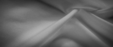 Pürüzsüz kıvrımları ve yumuşak kıvrımları olan bu gri pullu kumaş, sofistike arka planlar yaratmak için mükemmel, dingin bir doku sunar. Narin dokuması lüks ve yumuşak bir görünüm sağlıyor..