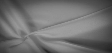 Bu gri ölçekli kumaştaki ışık ve gölgenin etkileşimini bulanıklaştırmak rahatlatıcı bir görüntü yaratır. Karmaşık kıvrımları ve pürüzsüz dokusu, az gösterilmiş bir zarafet gerektiren arka planlar için mükemmeldir..
