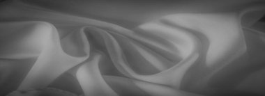 Bu gri pullu kumaşın yumuşak kıvrımlarını ve akışkan dokusunu bulanıklaştır. Pürüzsüz görünüm ve ince renklendirmeler bunu yaratıcı projeler veya kumaşla ilgili içerik için ideal bir zemin haline getirir.