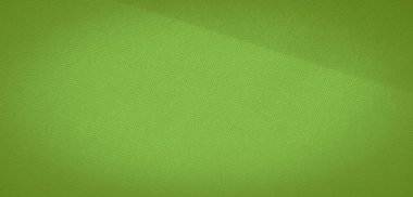 Akan kıvrımları ve yumuşak kıvrımları olan parlak yeşil kumaştan bir bulanıklık. Kumaşın hafif, havadar dokusu zarafet katıyor ve çeşitli yaratıcı projeler için uygun hale getiriyor..