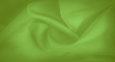 Parlak yeşil kumaş bulanıklığı, ince kıvrımlar ve ince bir doku. Yumuşak ve pürüzsüz özellikleri onu moda tasarımı, ev dekorasyonu veya tekstil arka planlarında kullanmak için ideal kılar..