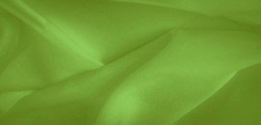 Bulanık yeşil kumaş yumuşak kıvrımlar ve ince kıvrımlar sergiler, kumaşın yansıtıcı özelliklerini artırır. Yumuşak kıvrım, pürüzsüz akışla parıldayan bir doku yaratır..