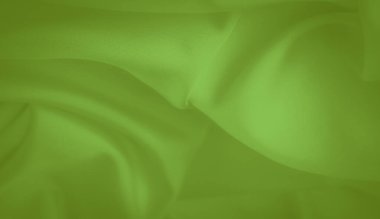 Yumuşak dalgalarla katlanmış açık yeşil kumaş bulanıklığı. Saten benzeri doku yumuşak ışık altında parlar, kumaşa lüks bir his verir. Canlı yeşil renk, soyut kıvrımlara tazelik ve modernlik ekler..