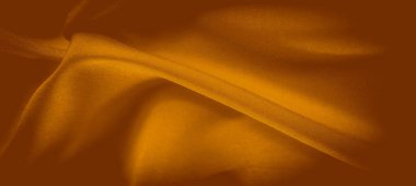 Pürüzsüz, pürüzsüz dokuları ve yumuşak kıvrımları olan turuncu kumaş bulanıklığı. Kumaşın yüzeyi yumuşak ışığı yakalar ve sıcaklığı ve konforu çağrıştıran dinamik bir akış yaratır..