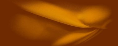 Yumuşak, turuncu kumaş, pürüzsüz kıvrımlar ve yumuşak kıvrımlar, kusursuz bir akış yaratır. Işığın ve gölgenin etkileşimi, maddenin sıcaklığını ve dokusunu vurgulayarak boyutu ekler..