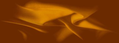 Bulanık altın-turuncu kumaş dalgalar halinde nazikçe katlanır, sakin ve zarif bir doku akışı yaratır. Işık yüzeyden hafifçe yansıyor, kumaşın lüks hissini vurguluyor..